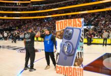 Mavericks Home Game Sponsored by TORRAS Launches, Special Edition Ostand Phone Case Stand Captivates Fans fan interacts with brand at Dallas Mavs game