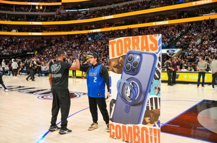 fan interacts with brand at Dallas Mavs game