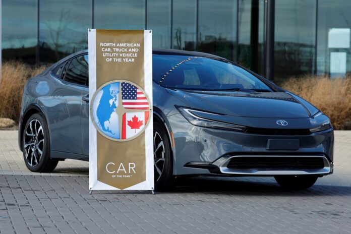 Toyota Prius Prime with NACTOY banner