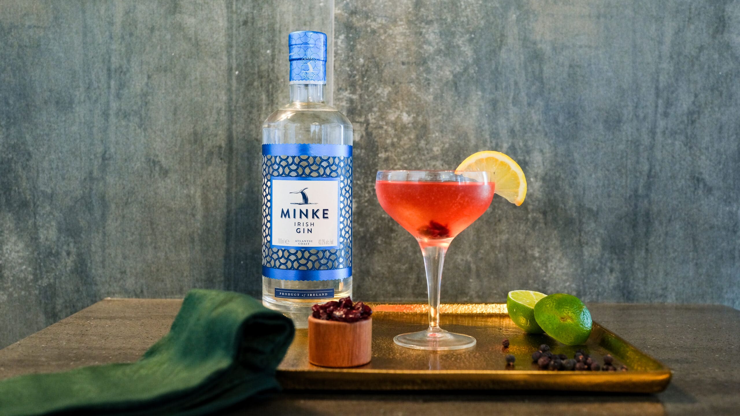 Minke gin bottle and pink cocktail