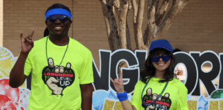 Longhorn Level Up Continues on February 13 at Cedar Hill High School two students wearing neone yellow shirts