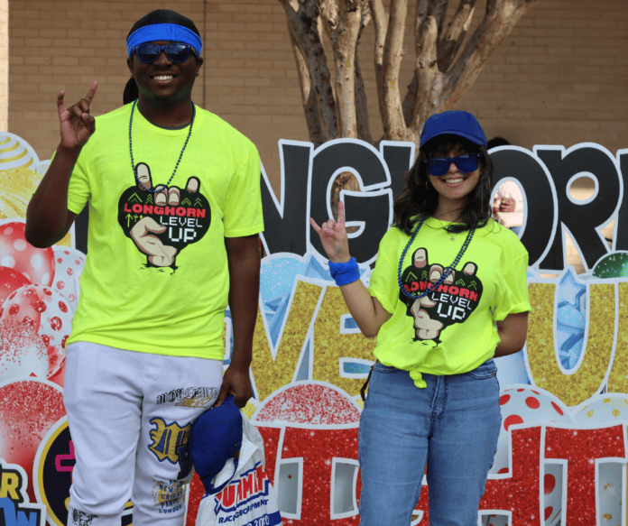 two students wearing neone yellow shirts