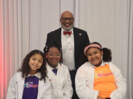 Cedar Hill superintendent with three students