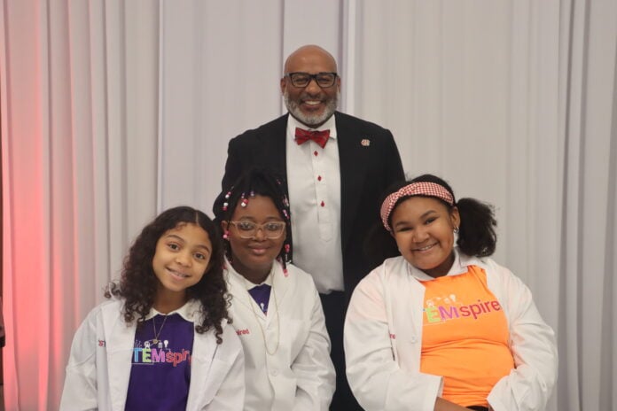 Cedar Hill superintendent with three students