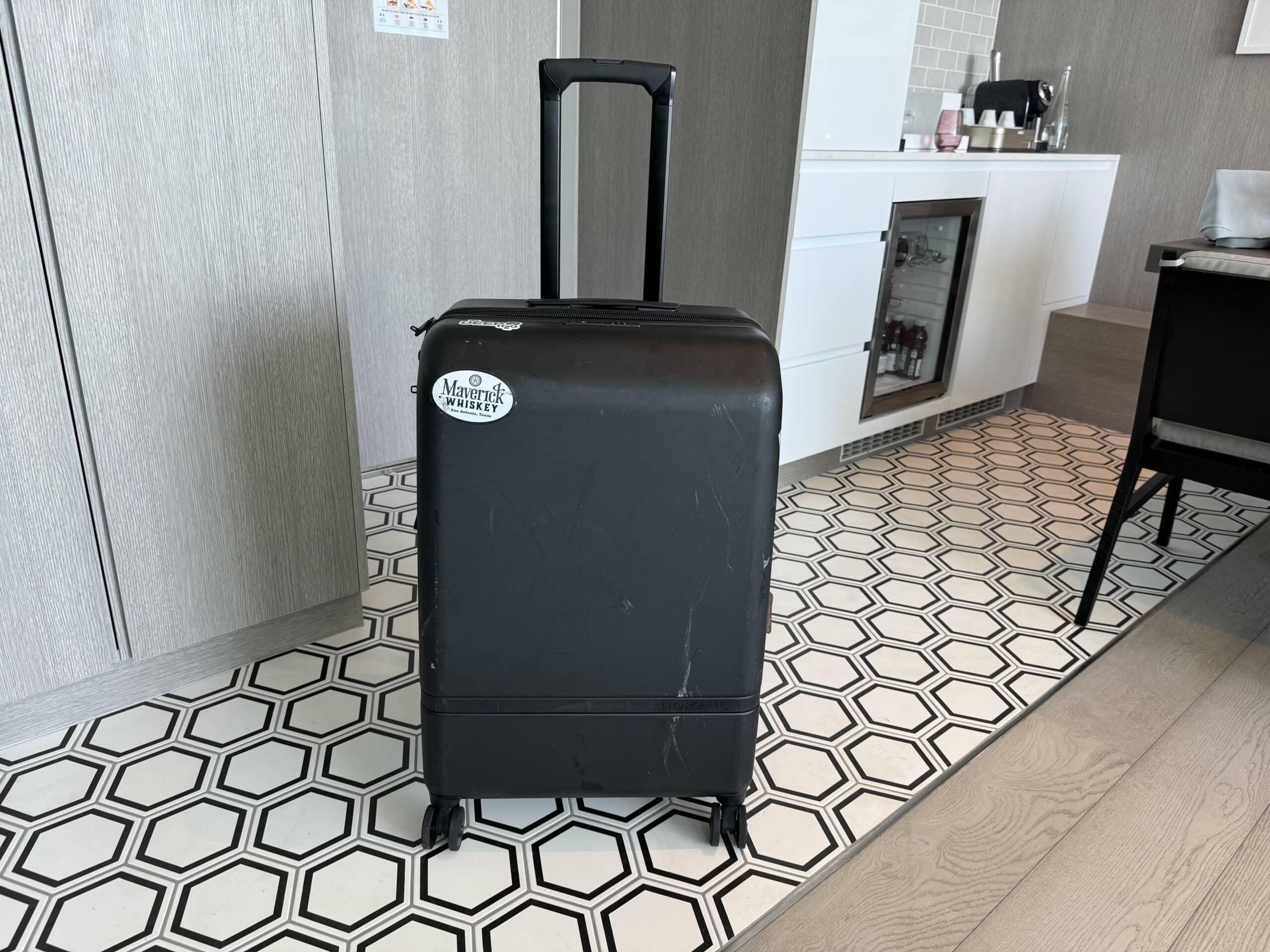 Nomatic check in suitcase with handle extended