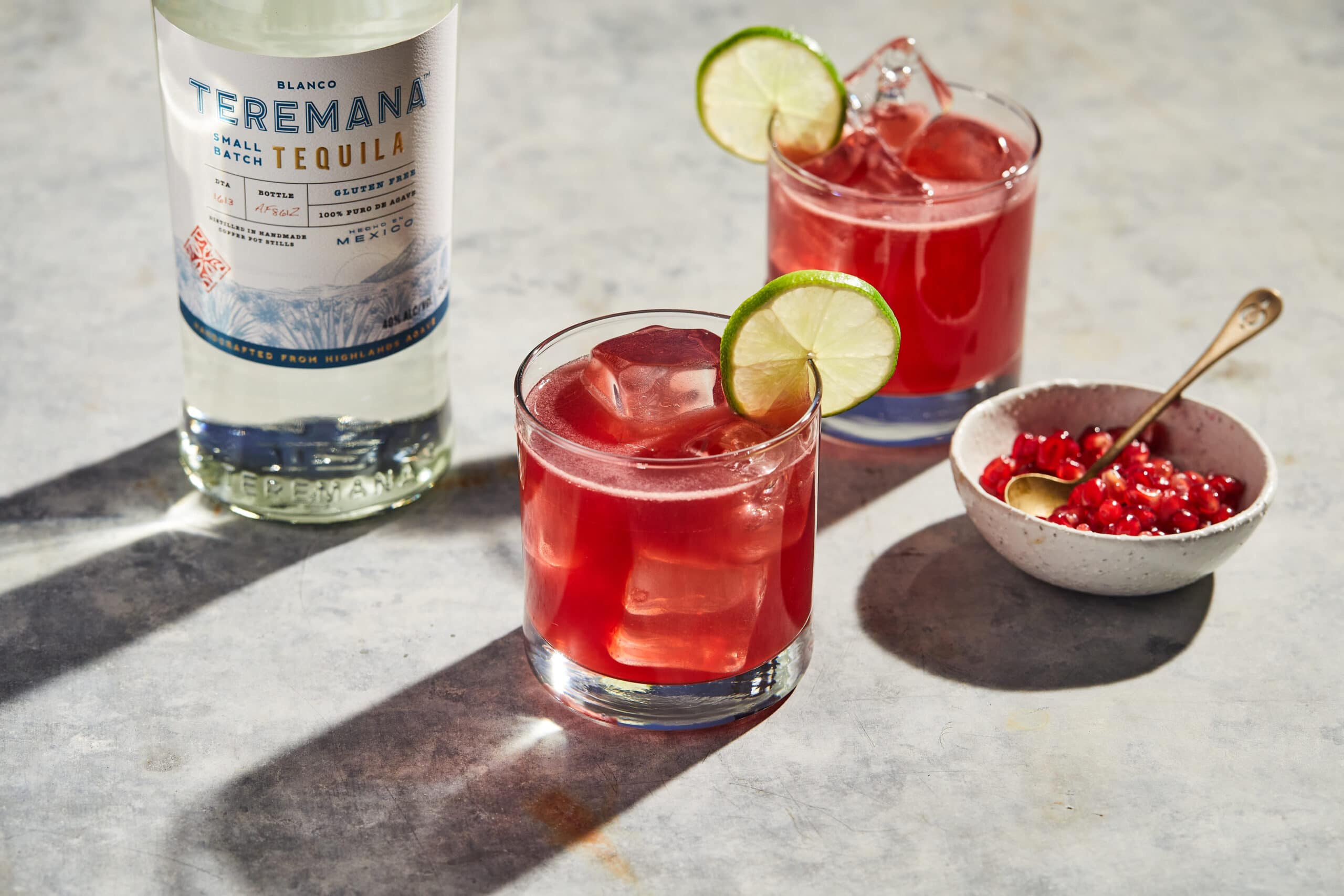 Pomegranate manaritas with pomegranate in a bowl