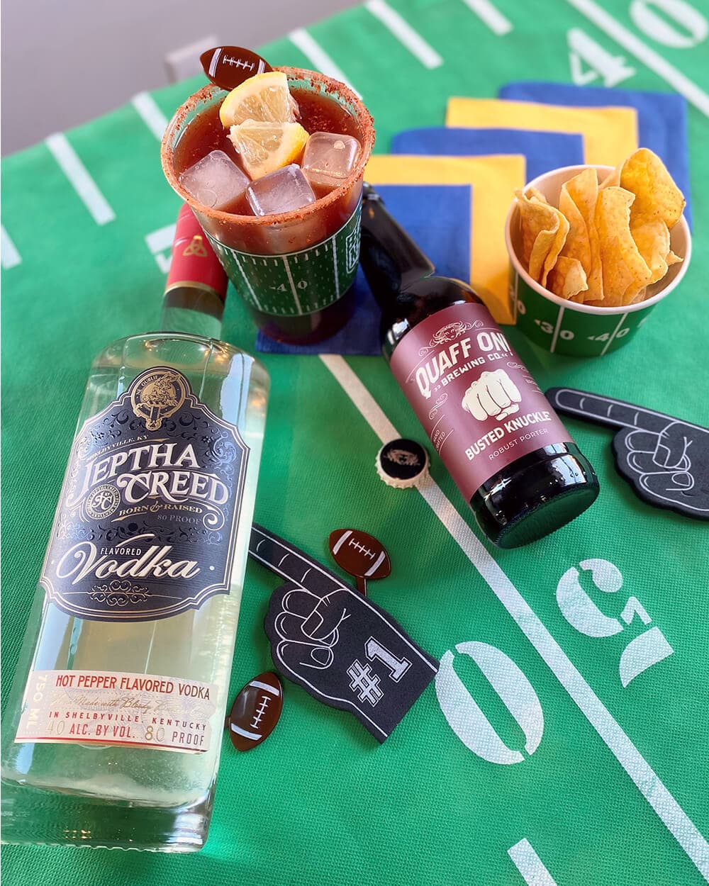 Jeptha Creed vodka bottle with football field background