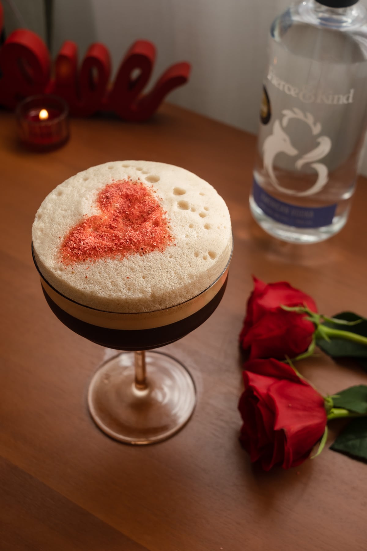 espresso martini with red heart in foam