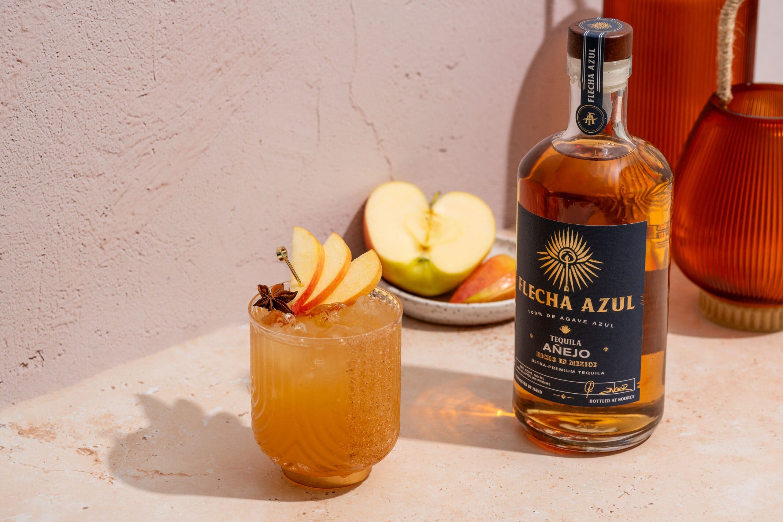 apple cider margarita with Flecha Azul anejo bottle