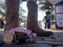 cowboy boots and race medal