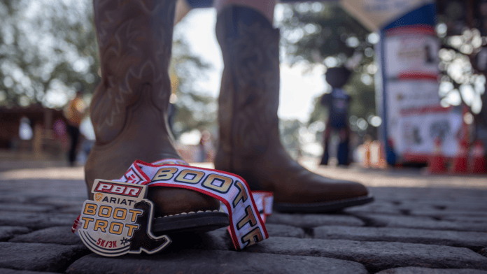 cowboy boots and race medal