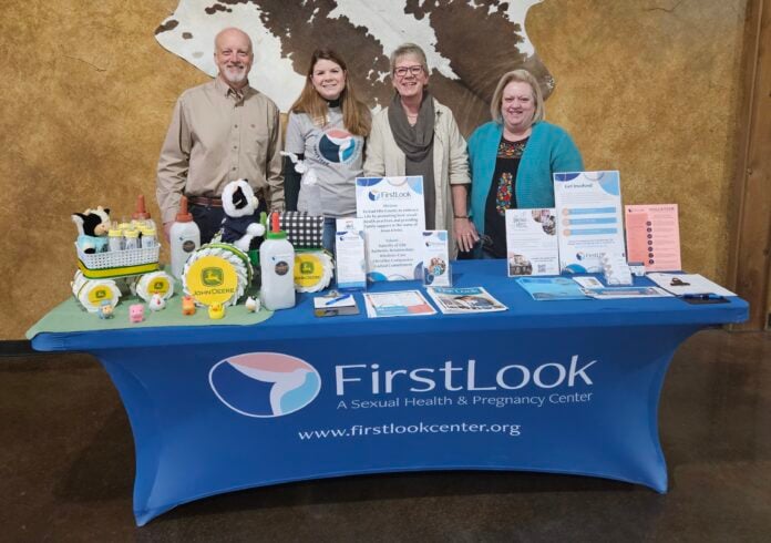 First Look table with people standing behind it