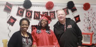 Cedar Hill ISD Hilltop Academy Graduate Thankful For Opportunity man and woman with student in graduation gown
