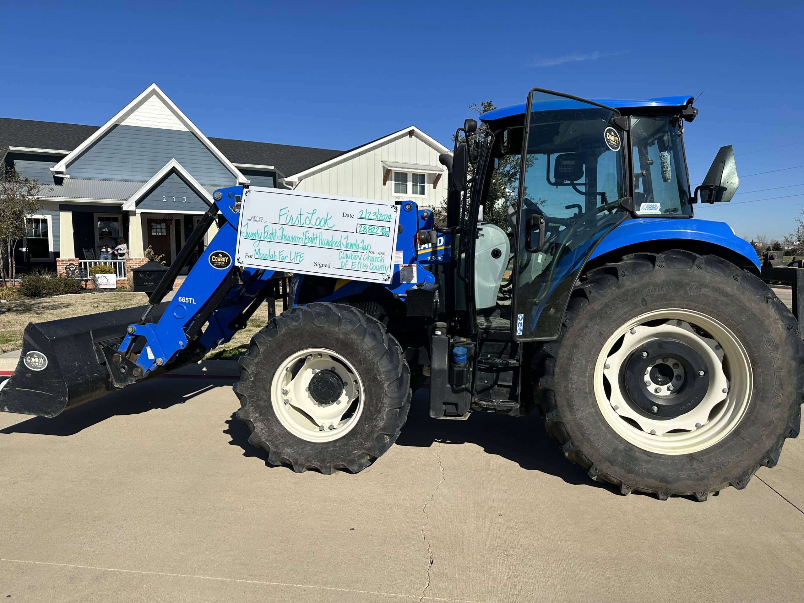 blue tractor with carboard check