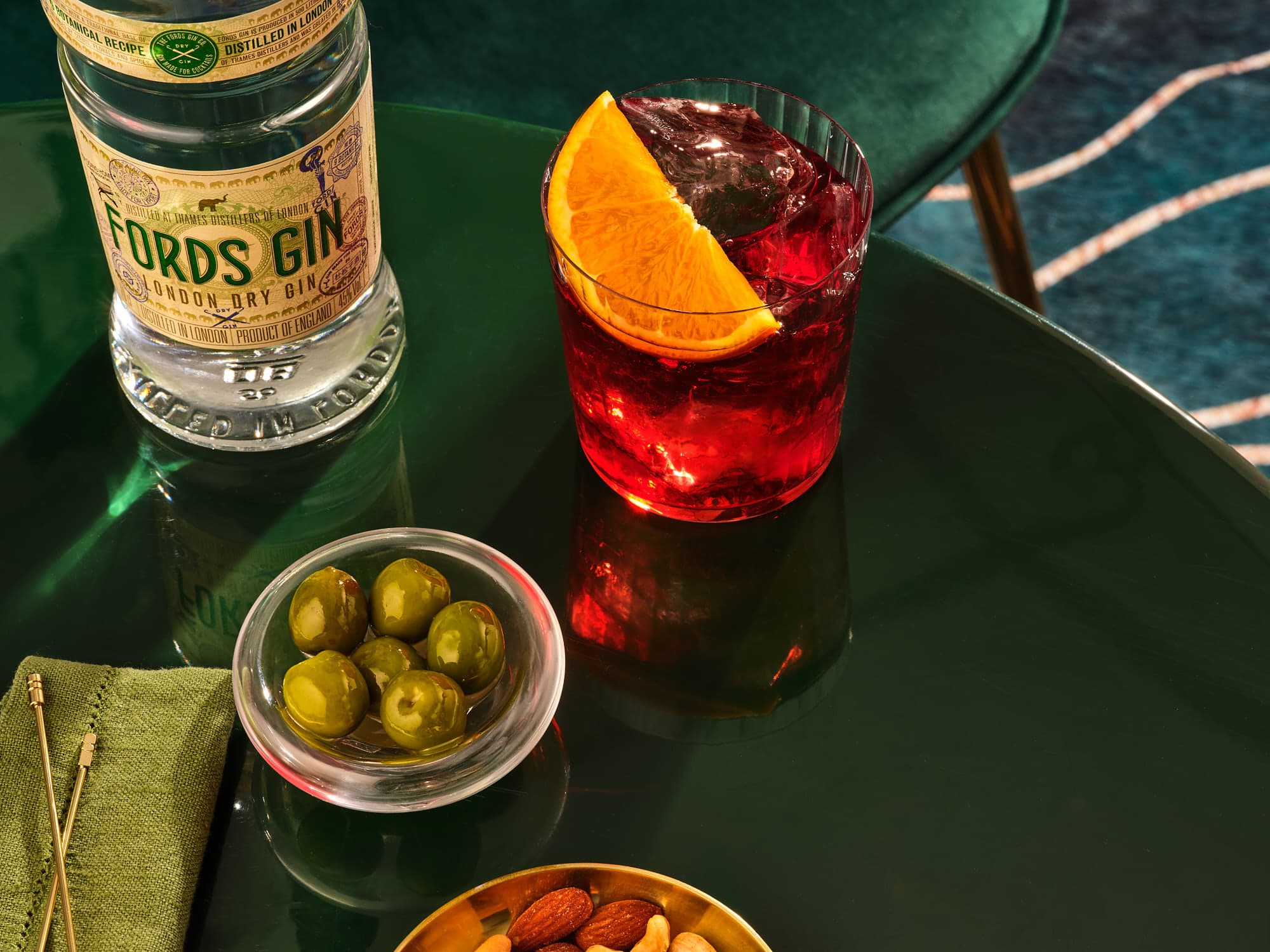 negroni with bowl of olives