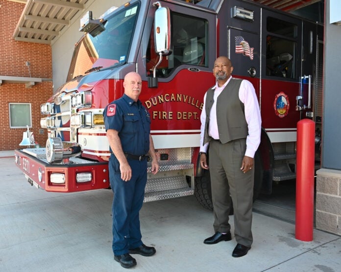 two guys by fire truck