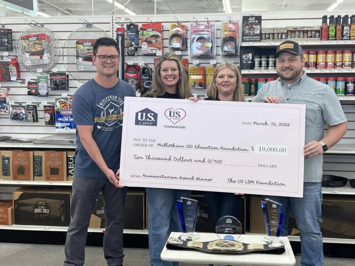 two guys and two women holding cardboard check