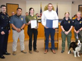 Pictured from left are Chief Carl Smith, Alex Cervantes, supervisor; and officers, Trinity Peel, Madison Reesing, and Karen Parrott. Also pictured is Mickey, a mini-Australian Shepherd
