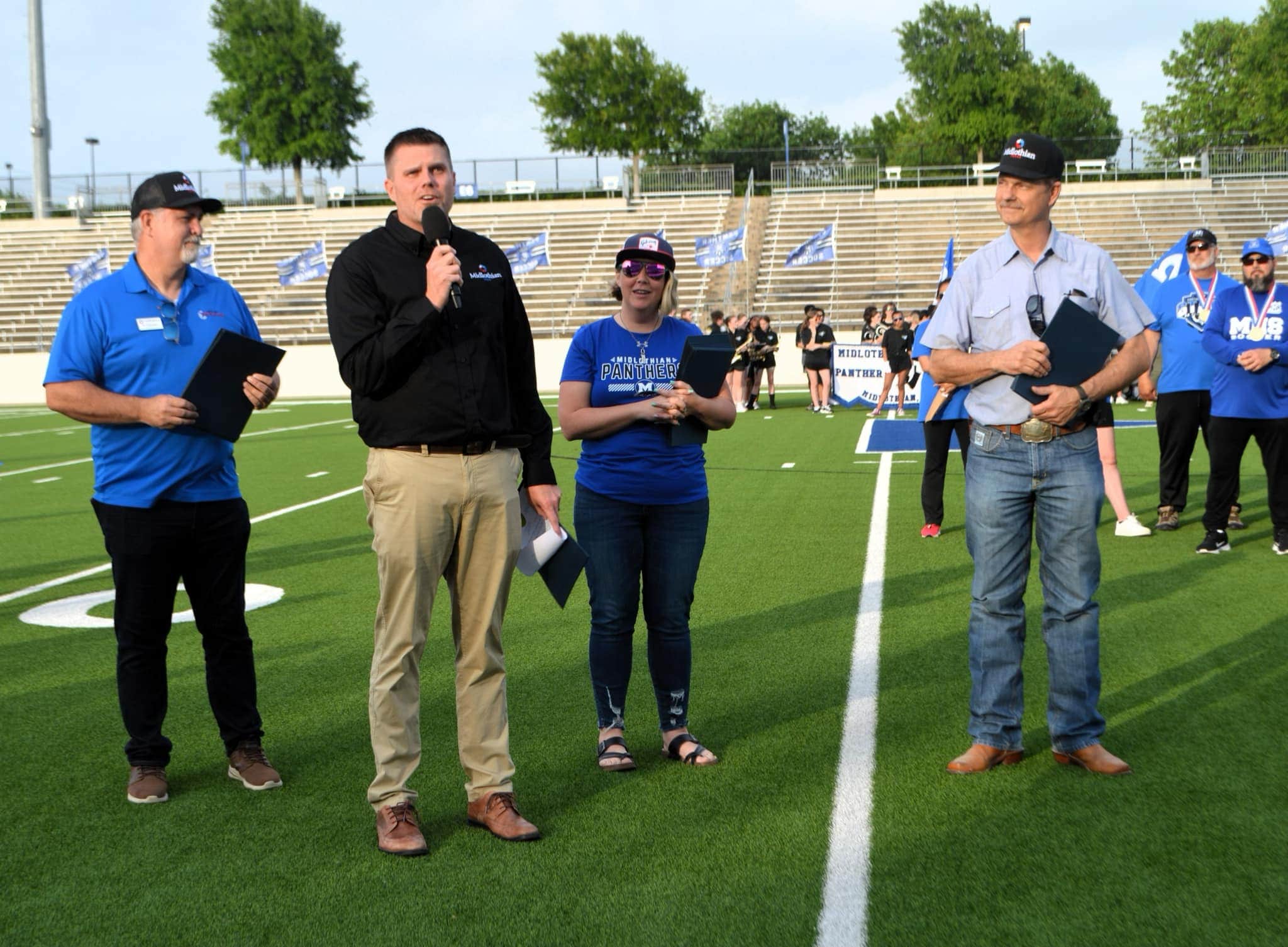 People standing on football field