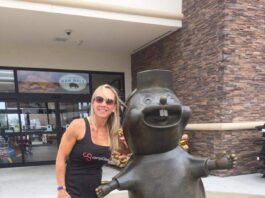 lady with beaver statue