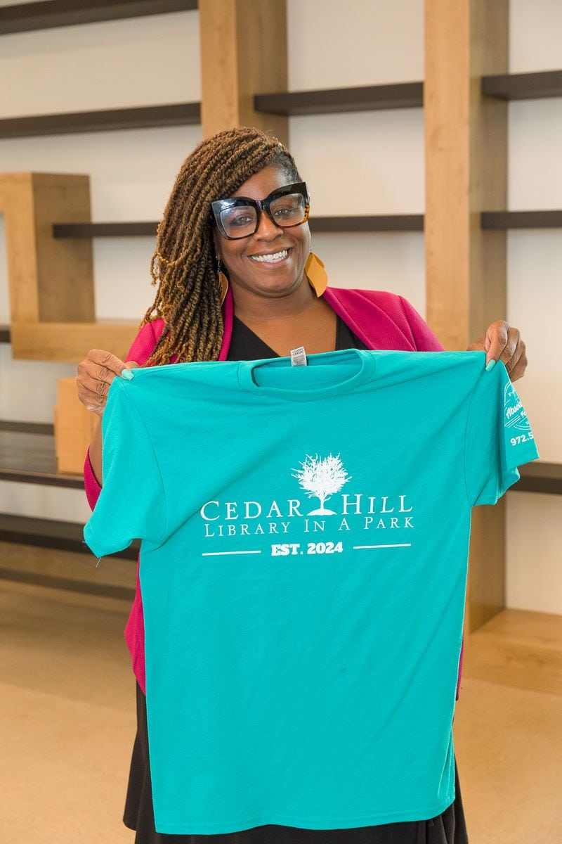 Library Director with volunteer T-shirts