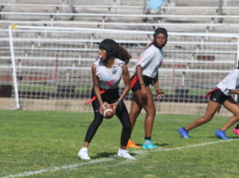 girl holding football
