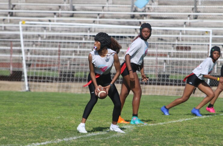 girl holding football