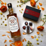 Mom-Approved Marvels: The Ultimate Mother’s Day Gift Guide for Every Superwoman in Your Life chocolates and bottle of whiskey