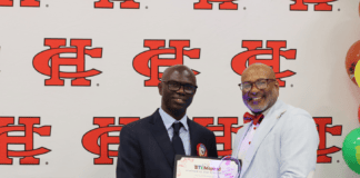 Longtime Permenter Middle School Teacher Earns Cedar Hill ISD STEM Teacher of the Year two men with CHISD logo