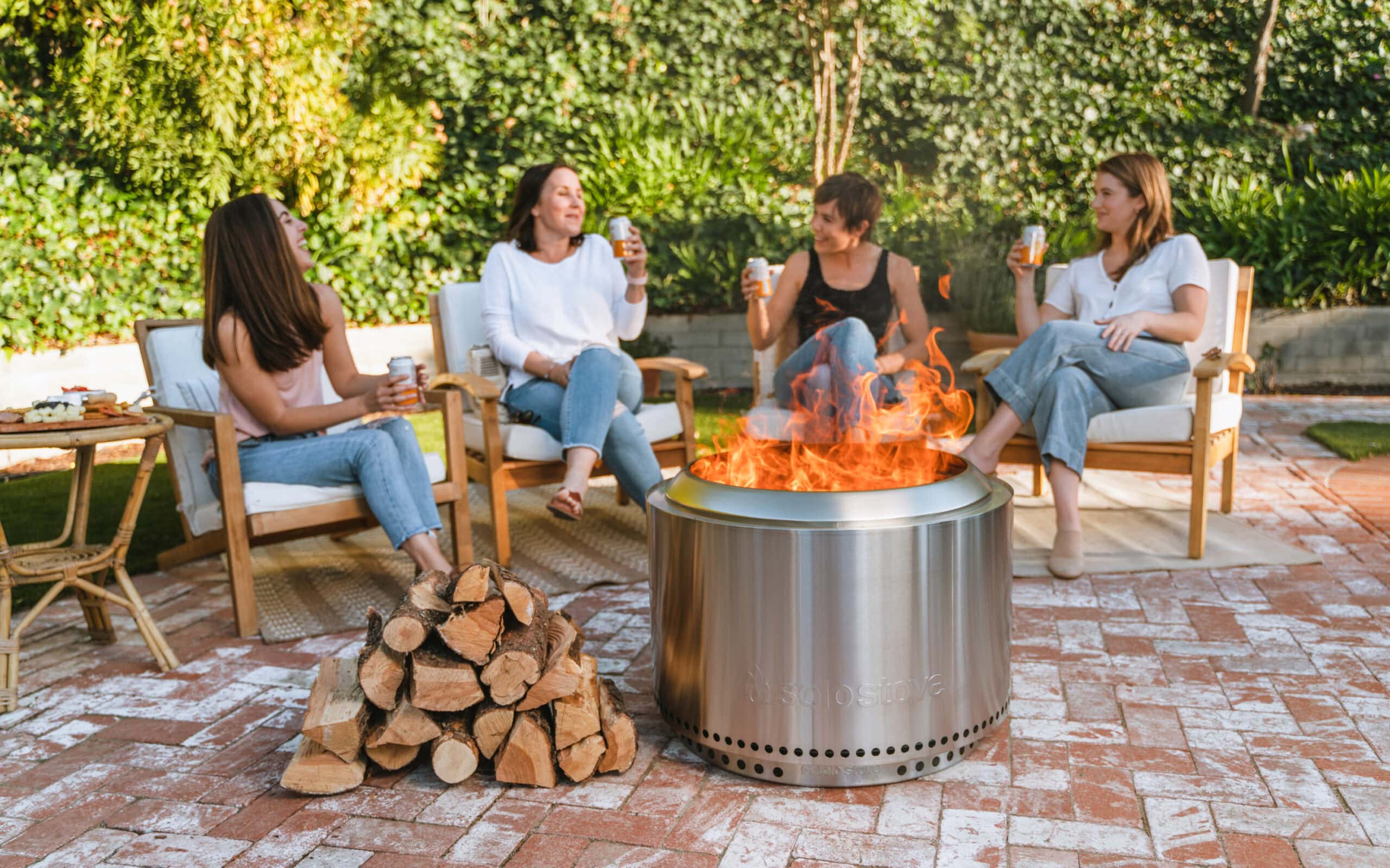 ladies sitting by firepit