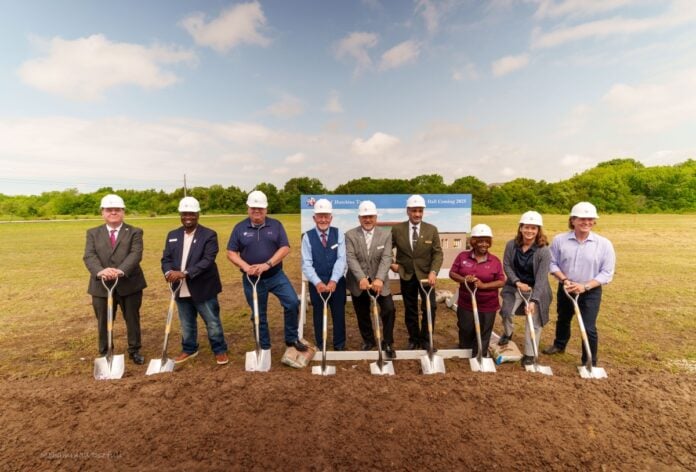 people with shovels and hard hats