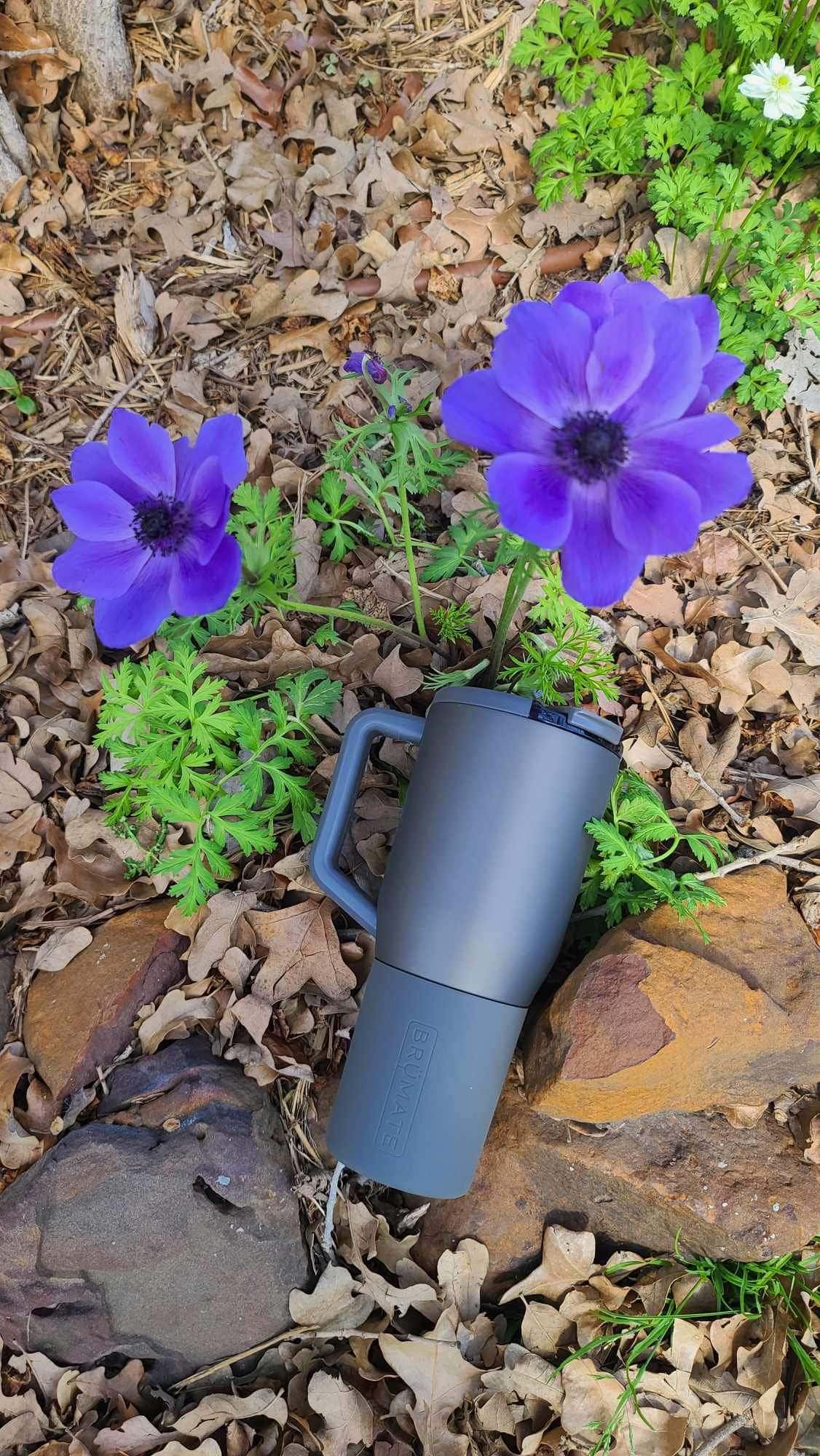 tumbler next to flowers