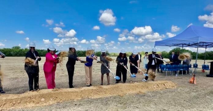 group of people with shovels