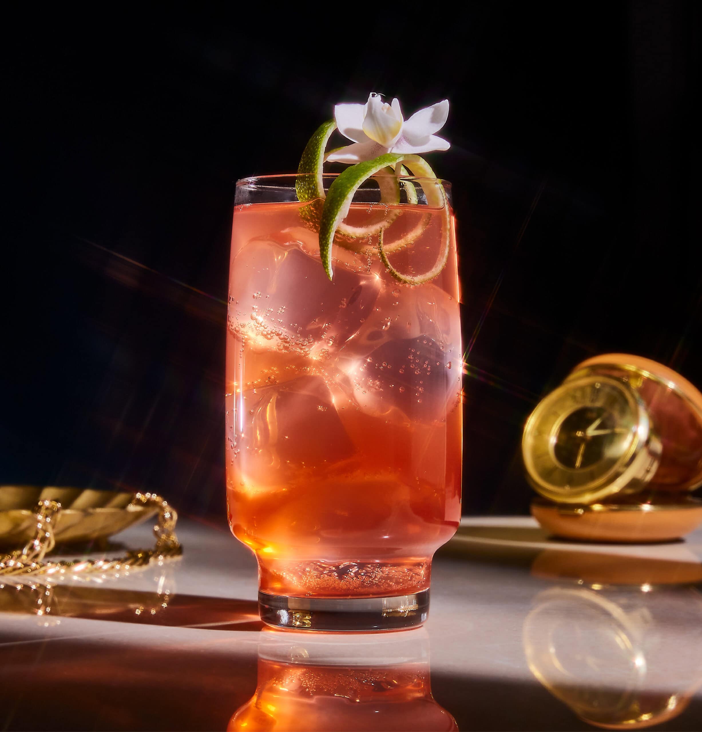 red beverage in cocktail glass 