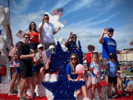 People on 4th of July parade float