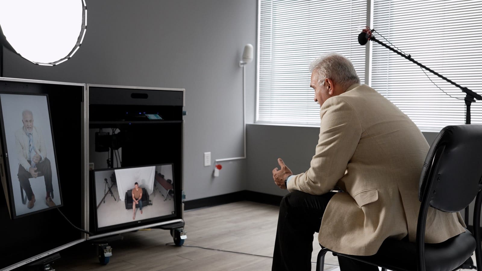 man in front of tv