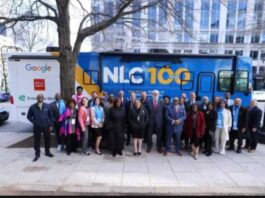 NLC 100 truck with group of people