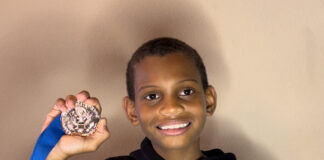 Collegiate Prep Rising Fourth Grade To Be Featured in Nickelodeon Kids’ Choice Awards young man holding a medal