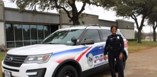 Duncanville ISD Officer Is Living The Dream With Special Training Duncanville ISD officer next to SUV