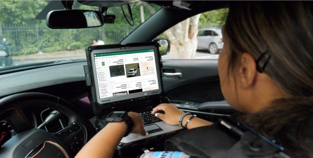 police officer with laptop