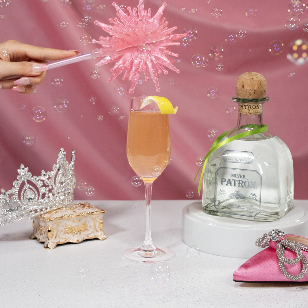 champagne glass with pink background