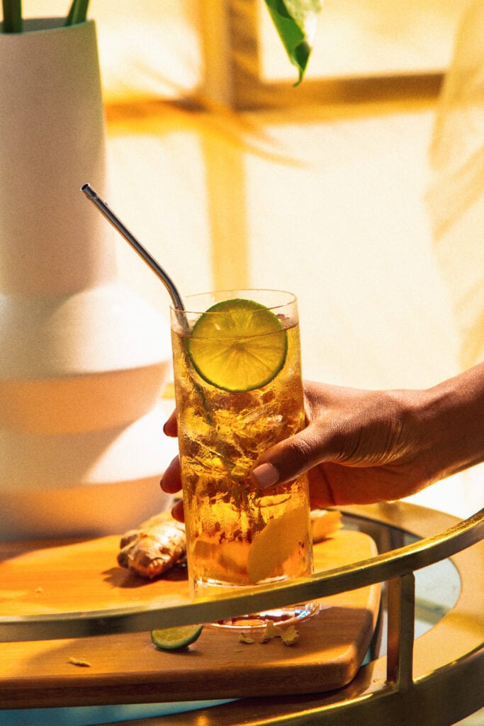 highball glass with lime garnish