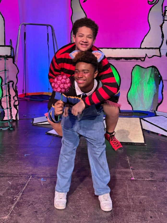 a boy with another boy on his back