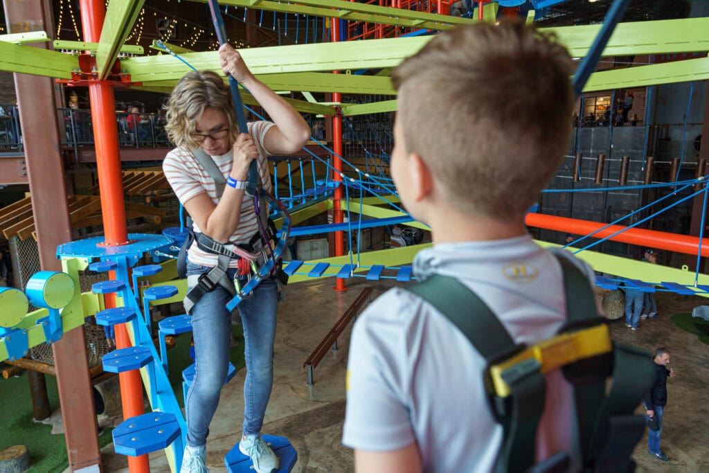 kid and lady on obstacle course