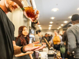 guy pouring whiskey