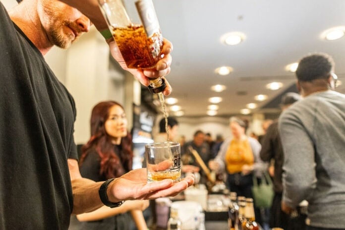 guy pouring whiskey