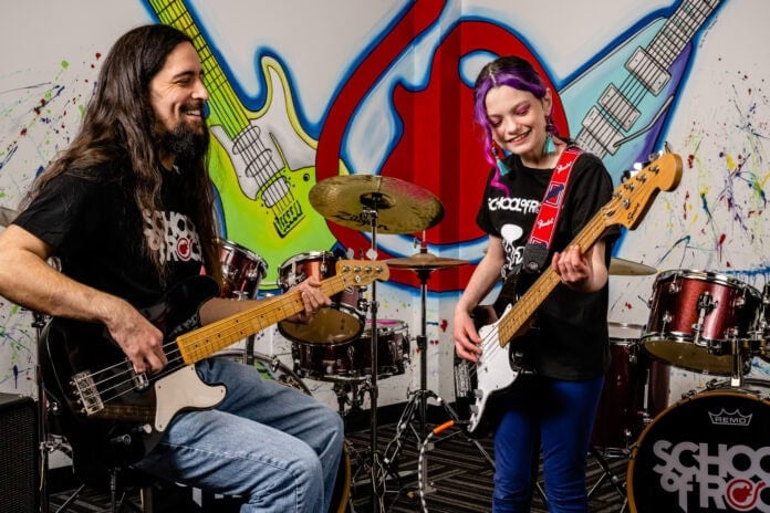 guy and girl with guitars