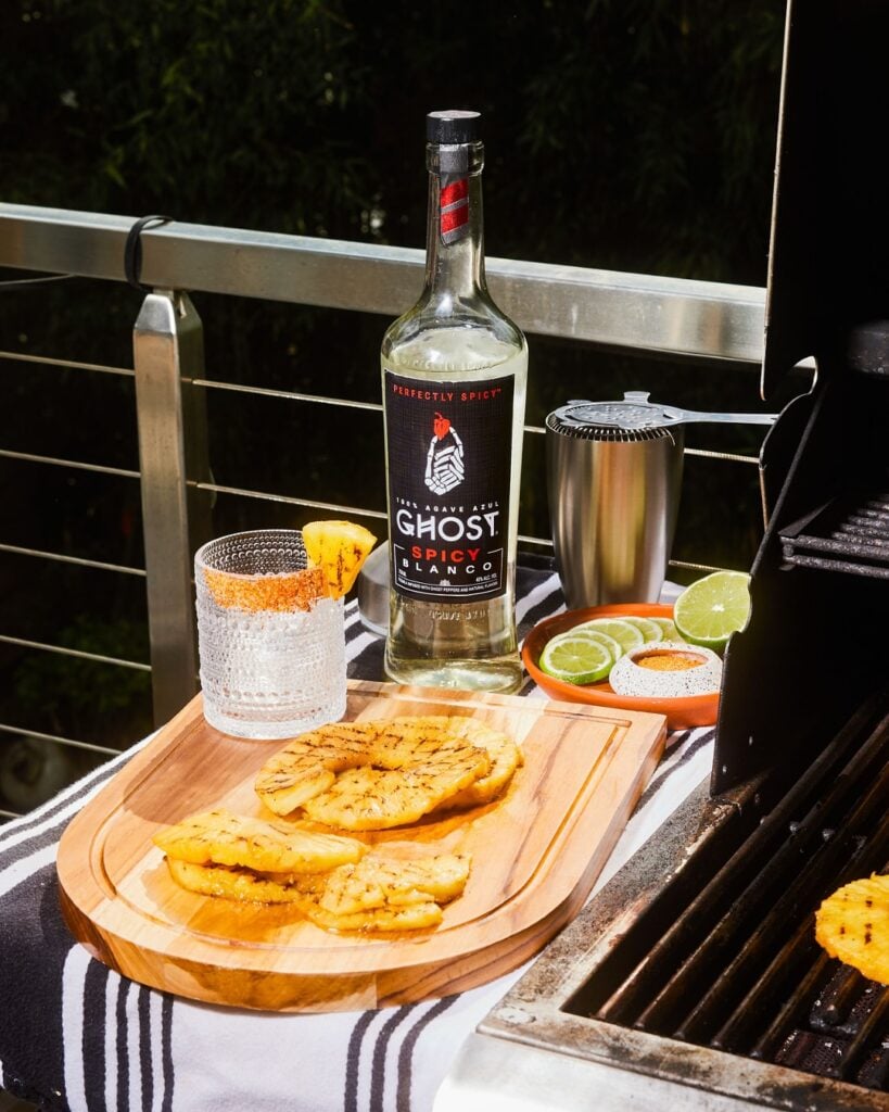 pineapple on cutting board with drink