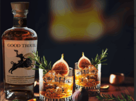 bourbon cocktail with fig and rosemary garnish