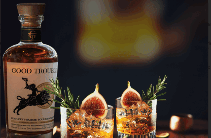 bourbon cocktail with fig and rosemary garnish